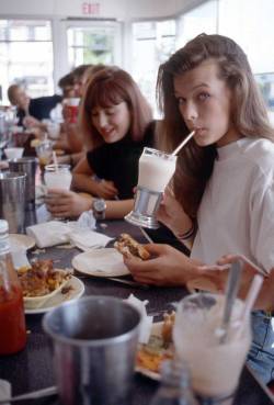 paxmachina:  A young Milla Jovovich having a burger and milkshake at Johnny Rockets on Melrose in Hollywood, 1987.