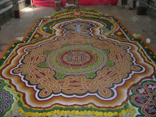 arjuna-vallabha:Nagamandala (mandala of snakes) made of colored powders and flowers  to worship