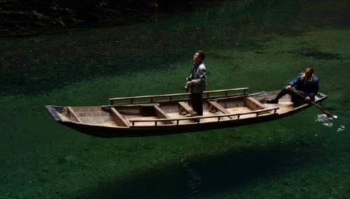 Valley in Ping Mountain屏山, Hefeng county鹤峰县, China. The water there is so clear that the boat is lik