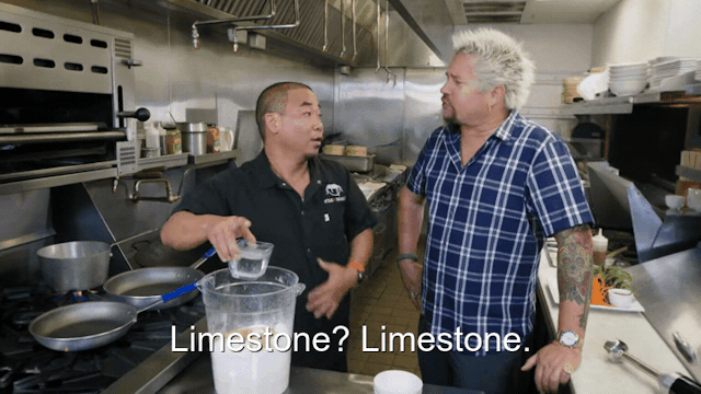 90% sure it's a person cooking in a kitchen preparing food. Caption: Limestone? Limestone.