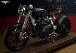 cafuneus:  2012 Thruxton-recplaceable gastank carbon kevlar covers and wooden seat aluminum billet frame and aluminum swing arm with eccentric hub 