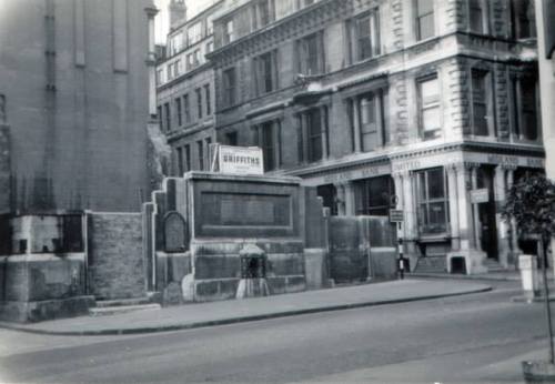 The Stone of BruteinOn a busy street in the middle of the City of London, hiding behind a metal gril