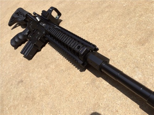 gunrunnerhell:  Beowulf 50 A custom built AR-15 chambered in 50 Beowulf. The factory gas block from Alexander Arms tends to be a bit bulky, making it difficult to conceal under a longer handguard. Interesting but probably more practical choice that the
