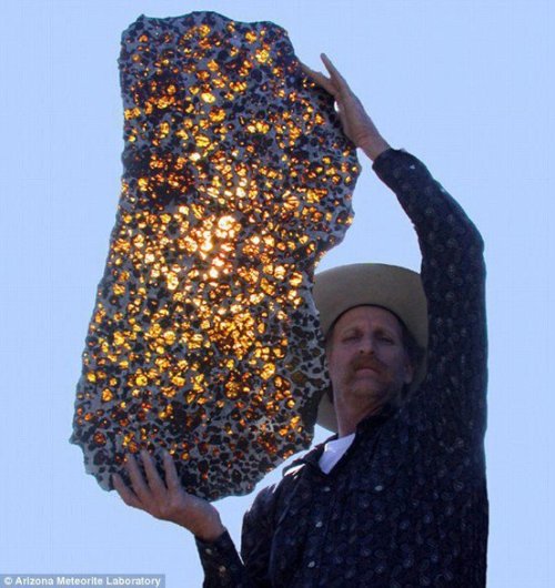 What you are looking at here is a slice of the Fukang Meteorite. The rare meteorite was discovered i