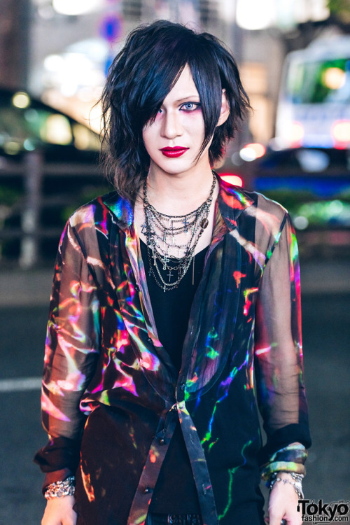 Yukito on the street in Harajuku wearing a colorful top and pants by If Six Was Nine with Midas fold