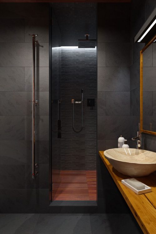 remodelproj: Dark tile with dark wood bathroom finishes Millionheir | Luxury At Its Finest