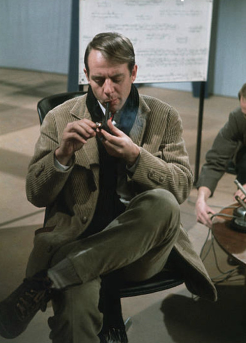Karlheinz Stockhausen smoking a pipe.