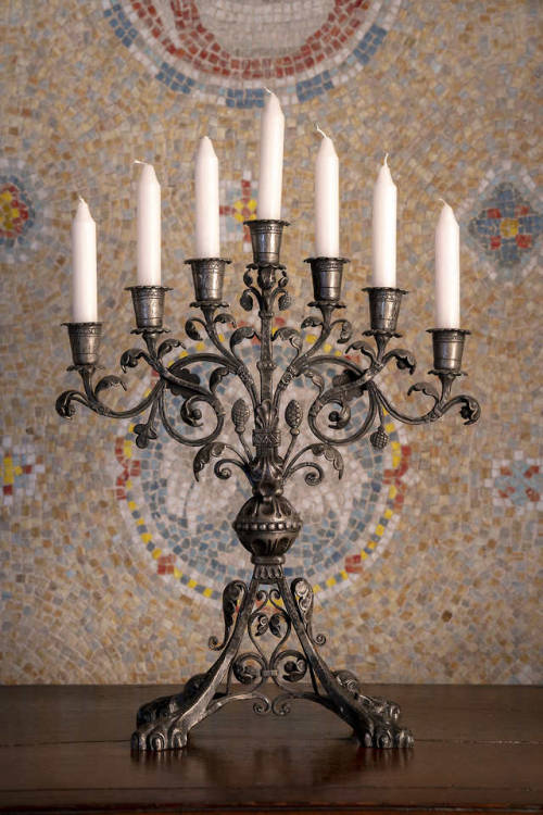 This seven-branched Monel candelabra, currently on exhibit in Glencairn’s entryway, was made b