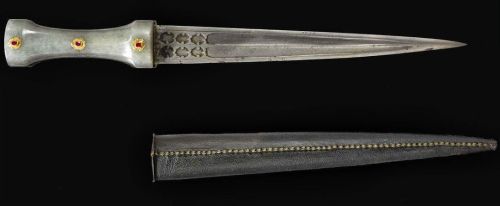 art-of-swords:  Ruby-Set Jade-Hilted Dagger  Dated: circa 1700 Culture: Ottoman Medium: steel, jade, rubies, gold, leather, wood Place of Origin: Turkey The double-edged double-groove watered-steel blade comes with stamped cartouches at the forte. The