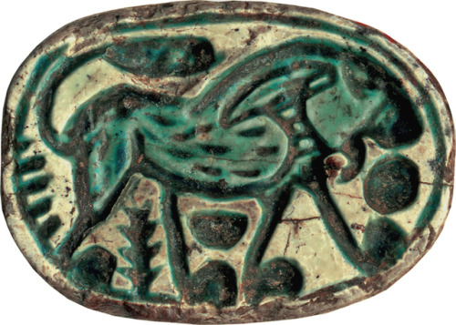 Canaanite scarab (steatite) featuring a walking lion design.  Artist unknown; ca. 1648-1539 BCE (Egy