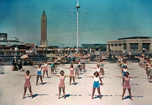 Free calisthenics lessons are given daily for beach visitors in Long Island, New York, 1939.Photogra