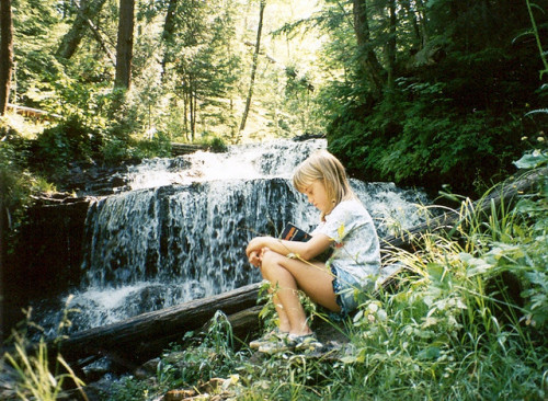 abookblog:  Emily Reading at Wagner Falls by CaptPiper on Flickr.