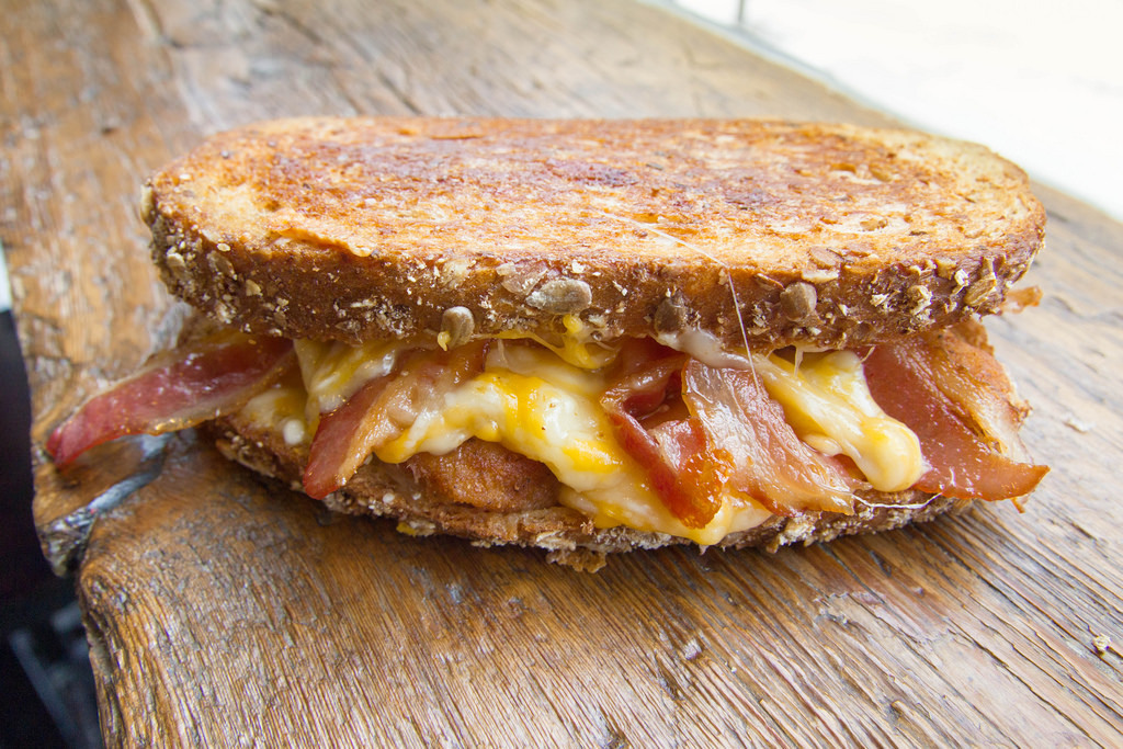 f-word:  tattooed chicken melt: multigrain bread, cheddar &amp; mozzarella cheese,
