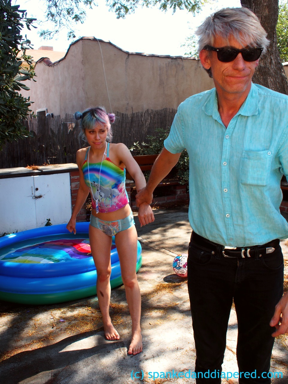 alexinspankingland:  Adorable little Dorothy was outside playing in the pool…without