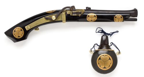 19th century Japanese matchlock pistol with matching powder flask.