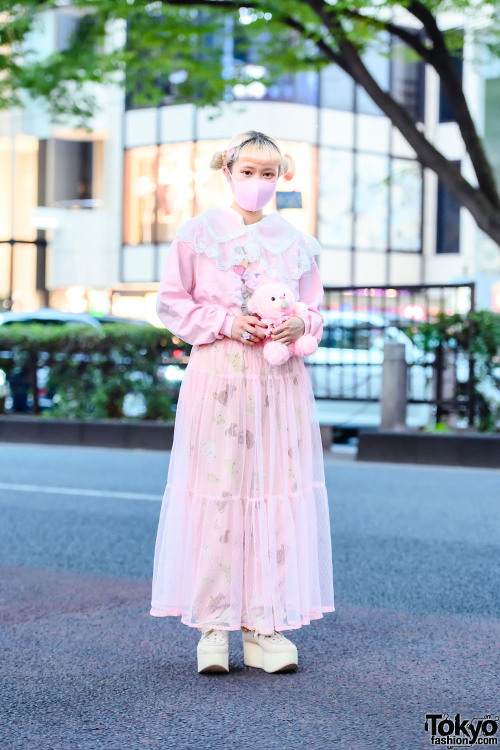 Japanese art student Akane on the street in Harajuku wearing a pink teddy bear themed vintage look w