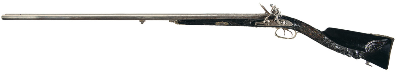peashooter85:  A double barrel flintlock shotgun with relief carved stock, maker