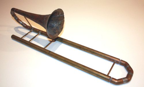 This is a home made slide trumpet, measuring about 2 ft long when contracted. It was meant to be tuned to B flat, but it wound up being tuned to C. I made this in high school as a side project, so the construction is sturdy, but unsightly. That said,