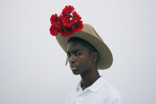 dynamicafrica:  In Conversation with Brandon Stanciell - The Man Who Loves Flowers.One of the first-ever photographs I came across involving a black man tenderly clutching flowers and gazing into  the lens of the camera was a self-portrait by Cameroonian