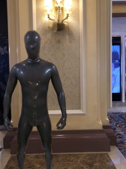 rubbermusclegod:Rubberdrone is ordered to hold still like a mannequin. While on display, any slight movement makes people suspect, rubberdrone will be punished and zipped into a rubber sleepsack for the night👿Anyone likes rubber mannequin challenge?