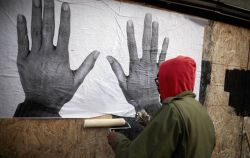 micdotcom:  Ferguson now has America’s most powerful street art   Damon Davis spent Thursday zigzagging across West Florissant Avenue, a paint roller in one hand and a bundle of posters under his arm.  His idea was simple: Since last summer, the quiet