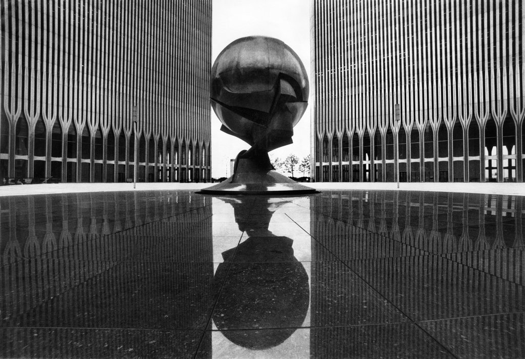 livelymorgue:
“ A bold statement between two towering obelisks: A spherical sculpture by Fritz Koenig flouted the hegemony of the straight line, provocatively declaring itself between the World Trade Center buildings. It was one of several abstract...