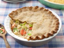 foodnetwork:Recipe of the Day: Trisha’s Chickless Pot Pie        Covered with a buttery crust and loaded up with peas, carrots and potatoes, this veggie pie is just as decadently satisfying as its meaty counterpart. Adding some food to the kink