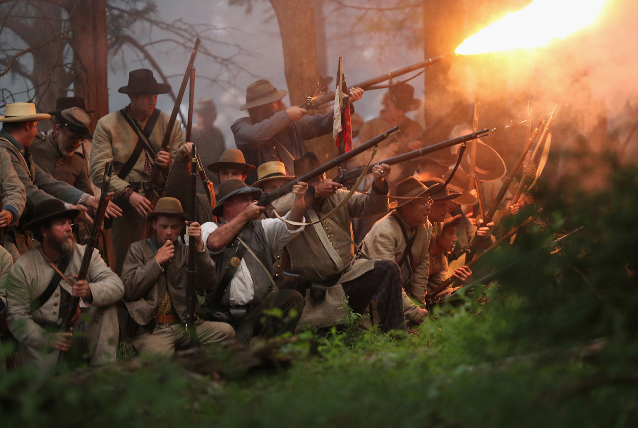 From The Battle of Gettysburg: 150 Years Ago, one of 33 photos. Here, Confederate Civil War reenactors launch an evening attack during a three-day Battle of Gettysburg re-enactment on June 29, 2013 in Gettysburg, Pennsylvania. Some 8,000 reenactors...