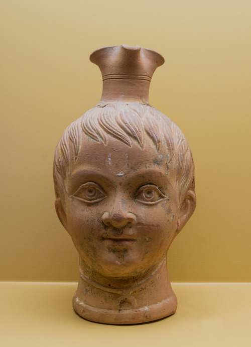 lionofchaeronea: Trefoil-mouthed vase in the shape of a boy’s head.  Artist unknown; 3rd 