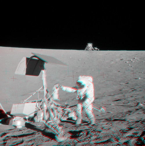 just–space:Apollo 12 and Surveyor 3 Stereo View : Put on your red/blue glasses and gaze across the western Ocean of Storms on the surface of the Moon. The 3D view features Apollo 12 astronaut Pete Conrad visiting the Surveyor 3 spacecraft 50 years