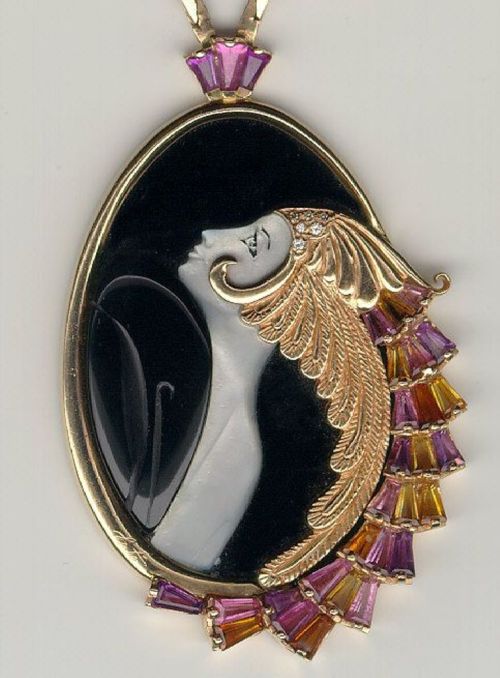blondebrainpower:“Beauty Of The Beast” by Erte - 14k yellow gold, mother of pearl, black onyx, pink tourmaline, citrine, and diamond pendant.