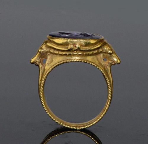 gemma-antiqua: Ancient Roman gold ring with an amethyst intaglio of Pan playing the pipes as a goat 