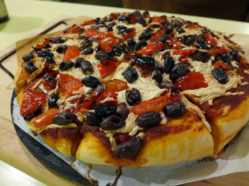 veganpizzafuckyeah:  Pizza! The top one has mozzarella Daiya, sundried tomatoes, Kalamata olives, and roasted red peppers. On the bottom: mozzarella Daiya and pineapples. Sorry for the lack of pizza selfies lately, but we just started fostering and things