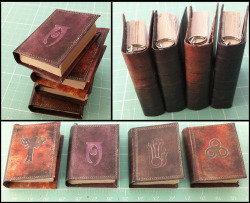 thisarenotarealblog:  arnixia-art:  Skyrim Mini Replica Tome Pendant Show off your magical prowess with these hand made Skyrim spell tomes.   Choose from four different schools:Alteration (orange) Conjuration (purple) Destruction (green)Illusion (red)