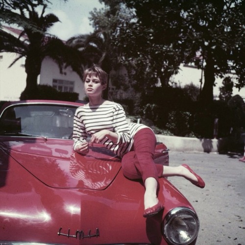 talesfromweirdland:Brigitte Bardot, wearing ballet flats, posing on a Simca. Mid-1950s.