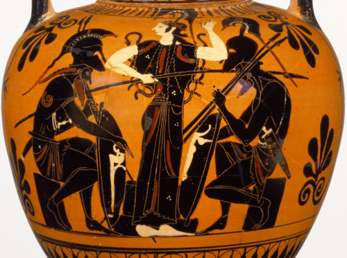 hellenismo:  Scenes from the mythological Trojan War decorate this Athenian black-figure neck-amphora. On the front, Achilles and Ajax, the two great Heroes of the Hellenes, sit playing a board game. The Goddess Athena stands in front of the board and