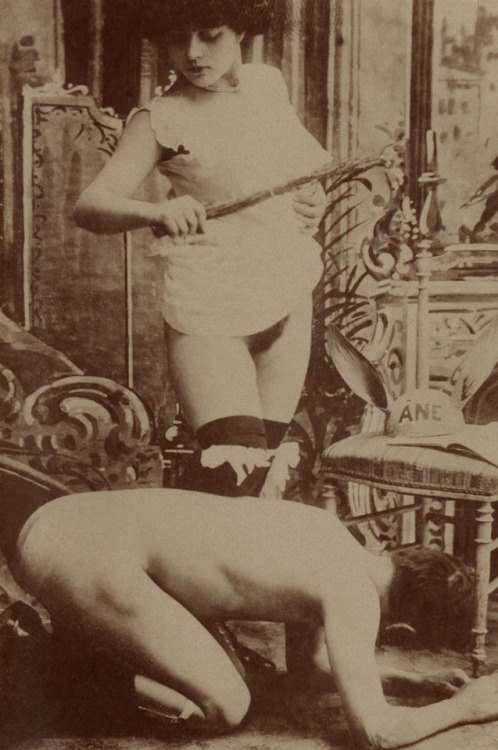 Unknown photographer (France): Woman holding a birch rod over a kneeling nude man, 1890-1900 