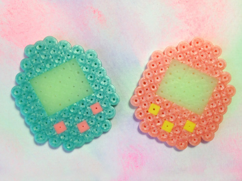 I love these tamagotchi pins. Pearlescent perler beads are bomb! The screens glow in the dark too.