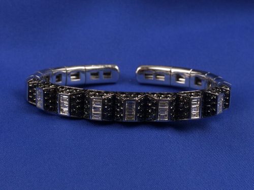 Black diamond, diamond, and white gold bangle bracelet (at Skinner)