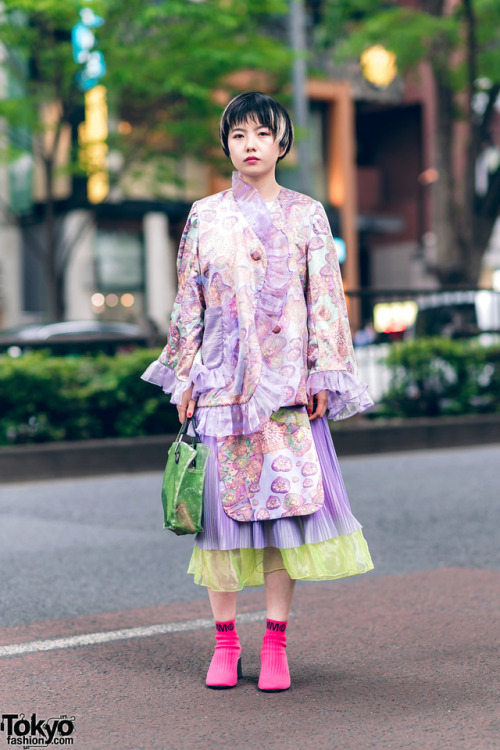 Fashion stylist Sho on the street in Harajuku wearing a graphic ruffle outfit by Kaoru Zhou with a B