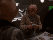 GIF of Rom from DS9 quoting Karl Marx: workers of the world unite, you have nothing to lose but your chains!