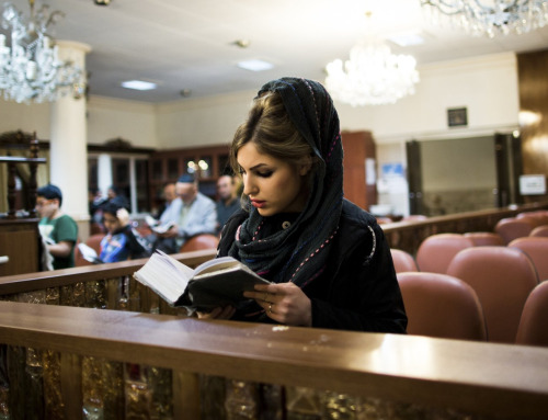 ofskfe:Iranian Jewish woman praying during Hanukkah, the festival of lights, at Abrishami synagogue 