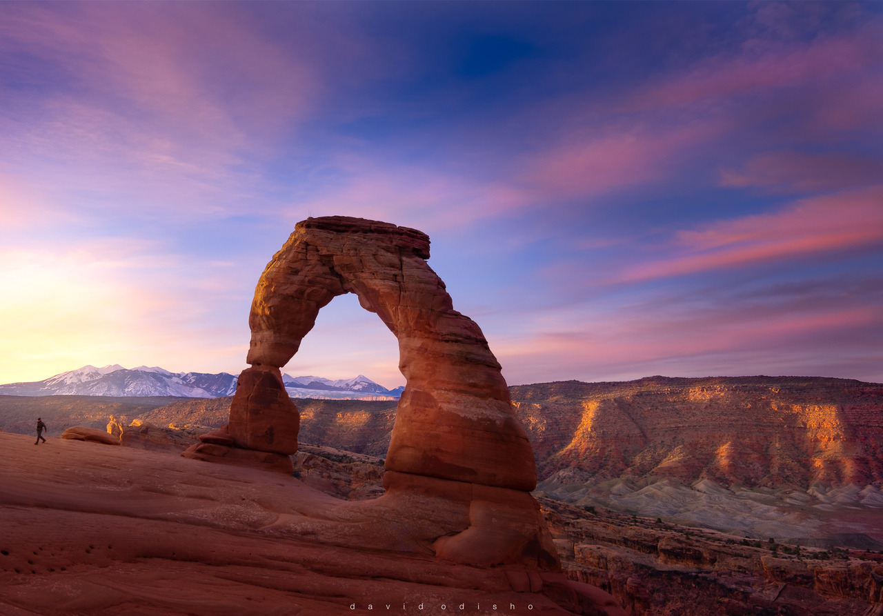 [Fuji X-T3 / XF 10-24 lens] - visit me at instagram.com/dave_odisho
Sunrise at Delicate Arch ~ Utah.
The person walking to the left of the frame will give you a perspective on the Arch’s immensity.