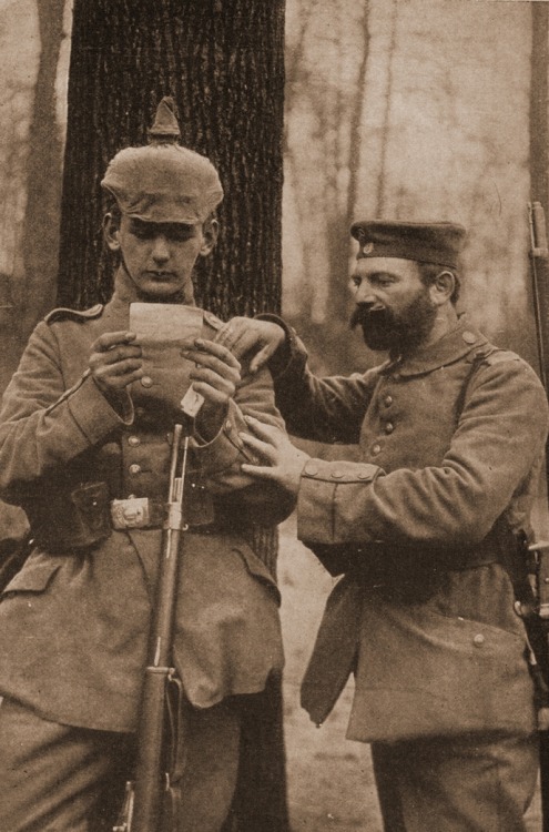 German father and son reading a letter on the battlefield near Rheims - WW1.