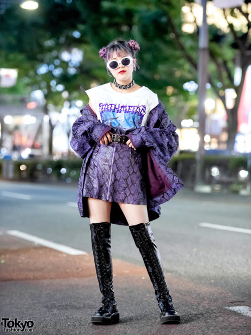 15-year-old Japanese student Megumi on the street in Harajuku wearing a matching purple snakeskin pr