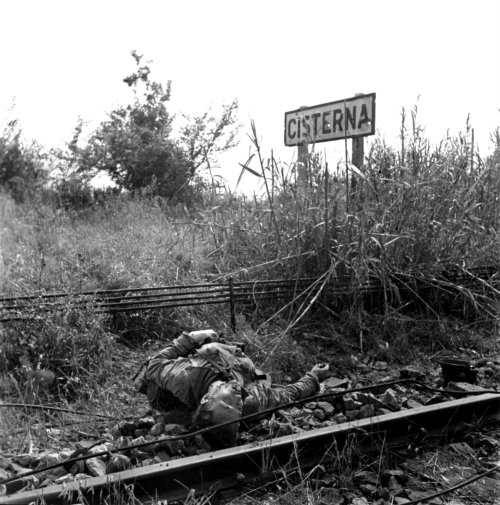 bag-of-dirt: The corpse of a German Wehrmacht soldier killed in action lies beside the railroad trac