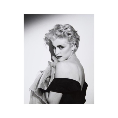 Madonna on the cover of a magazine in 1986 photographed by Herb Ritts.