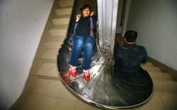 letsbuildahome-fr:  Fire Alarms Everyday An emergency slide is tried out in a building in Shanghai, China. The stainless steel chute has been attached to the banister of the stairs. The idea is that in an emergency the slide would be deployed and people