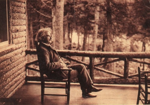 Mark Twain on the porch of his camp at Saranac Lake, NY.