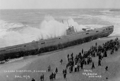 A German SM U-118 U-Boat lays washed ashore on Hastings beach. While it was being towed through the 